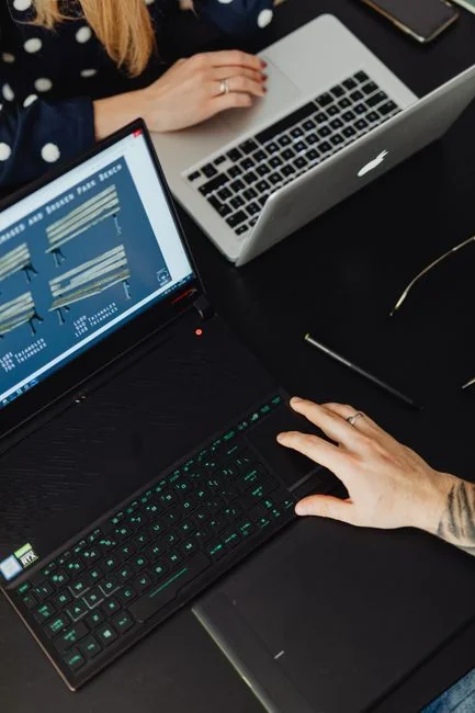creative Person shopping online using a laptop and credit card, highlighting e-commerce convenience.